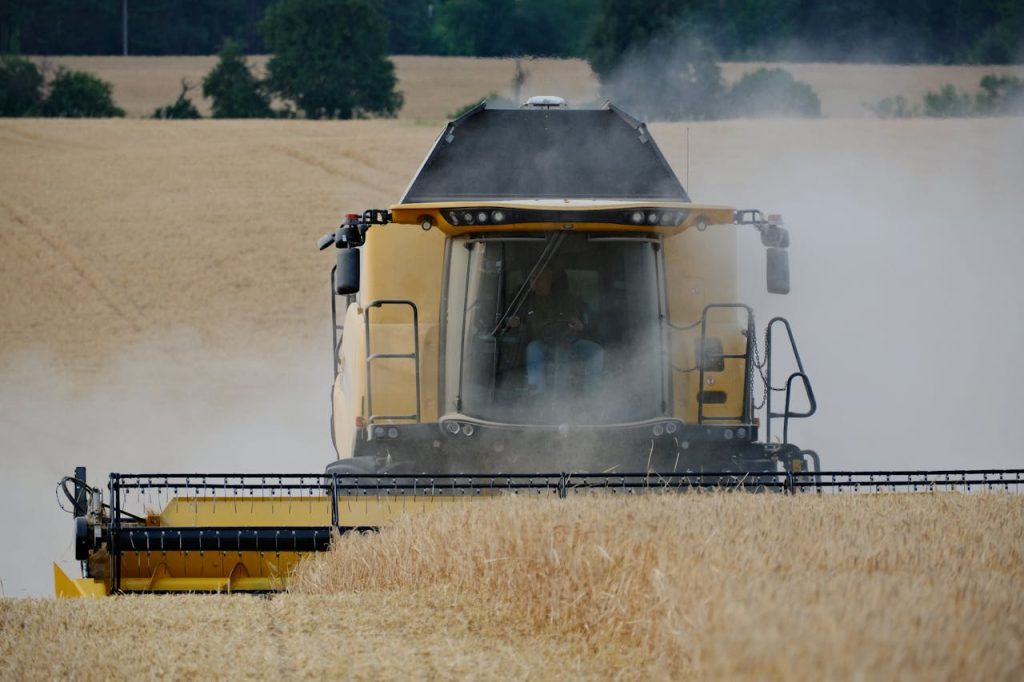 combine-harvester-working-in-wheat-field-32929629
